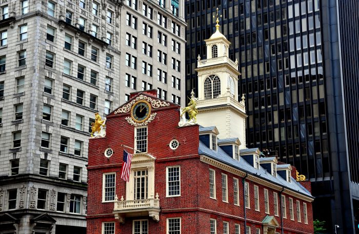Boston, Massacusetts - July 13, 2013:  The historic 1713 Old State House at the corner of State and Washington Streets is a landmark site on the Freedom Trail
